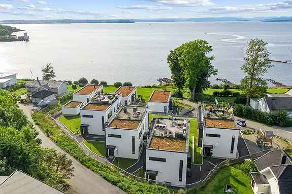 Halvpart tomannsbolig Fjordutsikt Takterrasse Elbillader